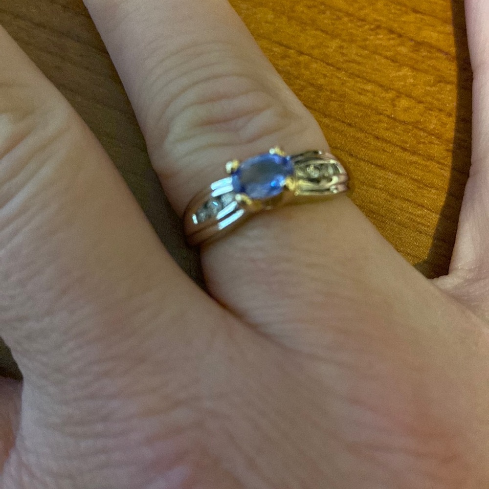 Stunning Tanzanite and diamond ring set in platinum and 14k gold prongs.